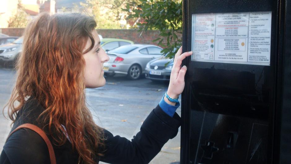 Woman At Parking Ticket Machine