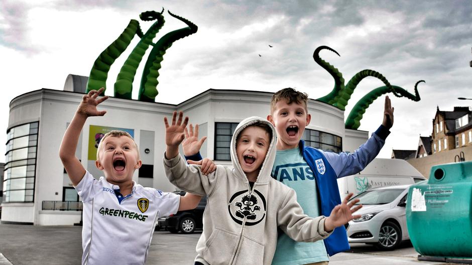 artwaves tentacles with children stood outside bridlington spa