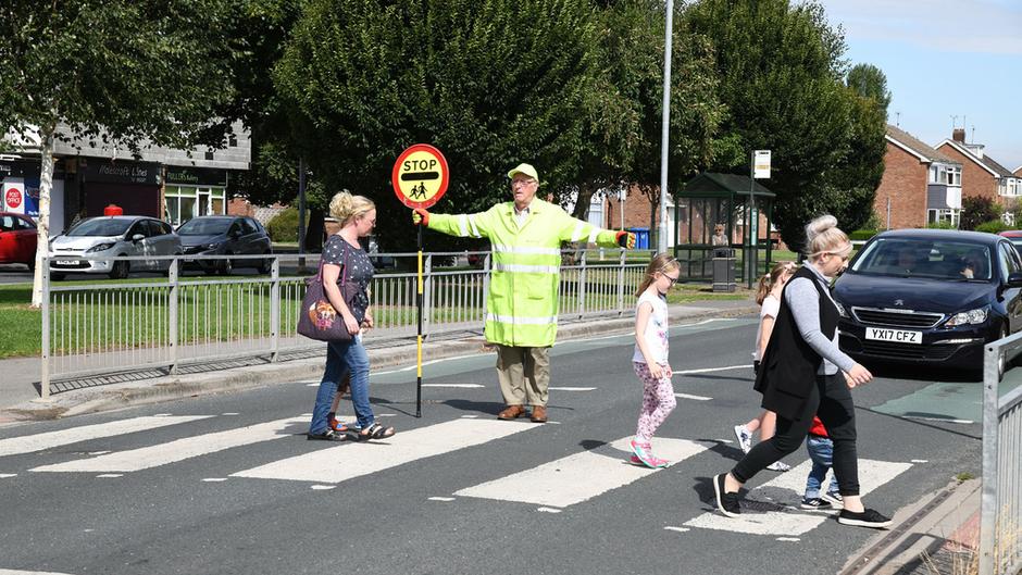 School Crossing Patrol Officer Tudor Jackson Helping People Across The Road In Beverley