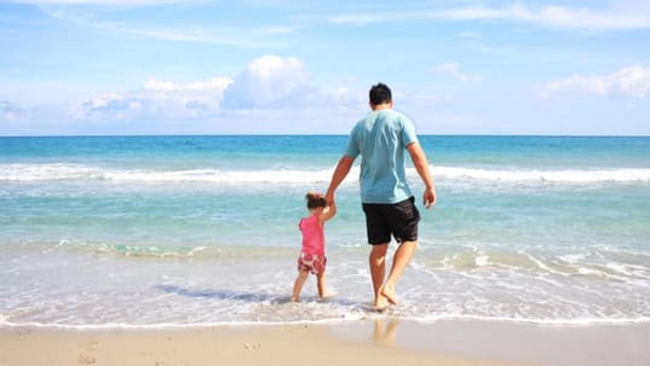 Dad And Daughter On Beach