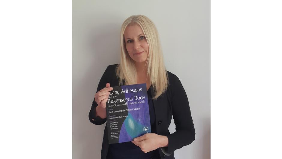 Dr Katerina Steventon With The Book That She Has Contributed To B